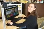 female student in front of computer monitor