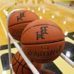 2 Basketballs in a Black Hawk Gymnasium